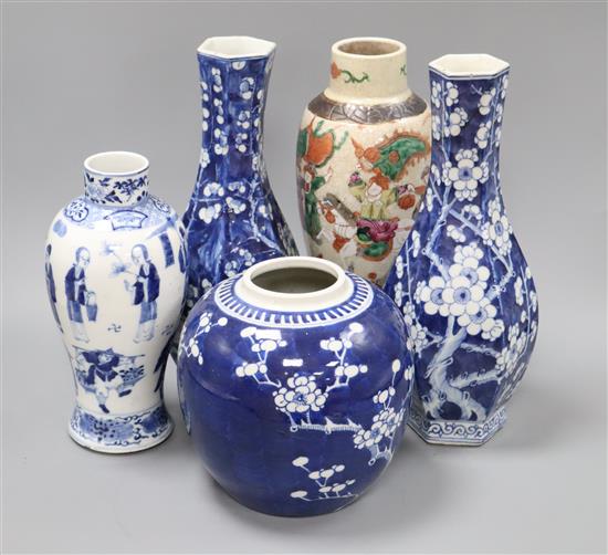 A pair of Chinese blue and white vases, a similar jar (lacking cover), a figural vase bearing Kangxi mark, together with another vase t